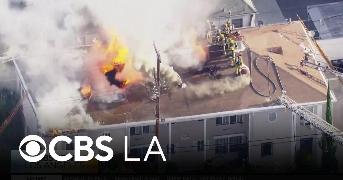Crews work to extinguish Koreatown apartment building fire - CBS Los ...