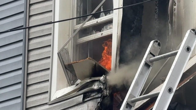 Fire in window of Queens home 