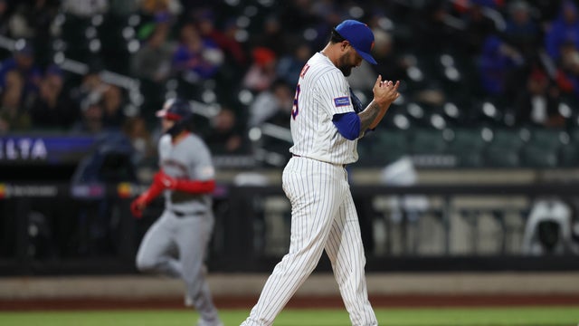 Pitcher Sean Manaea #59 of the New York Mets a reacts after giving up a grand slam to Brady House #12 of the Washington Nationals who rounds the bases during the fourth inning of a game against at Citi Field on April 29, 2026 in the Queens borough of New York City. 