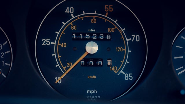 A car speedometer shows the speed of the car at 10 km/h 