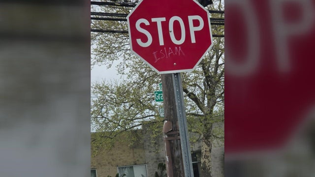 The word "Islam" written underneath the word "STOP" on a stop sign. 
