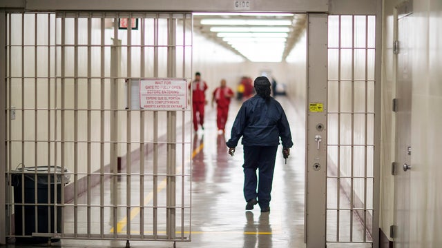 A detention officer walks through the halls at the Stewart Detention Center, Friday, Nov. 15, 2019, in Lumpkin, Georgia. 