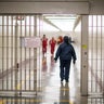 A detention officer walks through the halls at the Stewart Detention Center, Friday, Nov. 15, 2019, in Lumpkin, Georgia. 