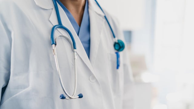close-up of a doctor's gown with stethoscope 