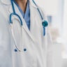 close-up of a doctor's gown with stethoscope 