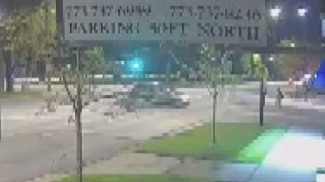 Flashing Lights and Police Tape Reading "Police Line Do Not Cross" 