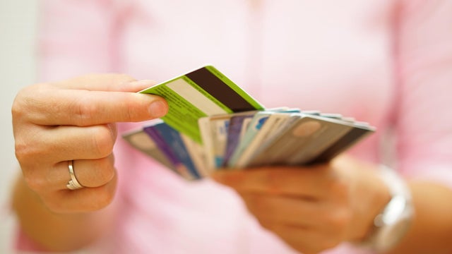 woman choose one credit card, concept of  credit  debt 