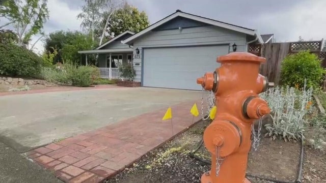 a hydrant in front of a home 