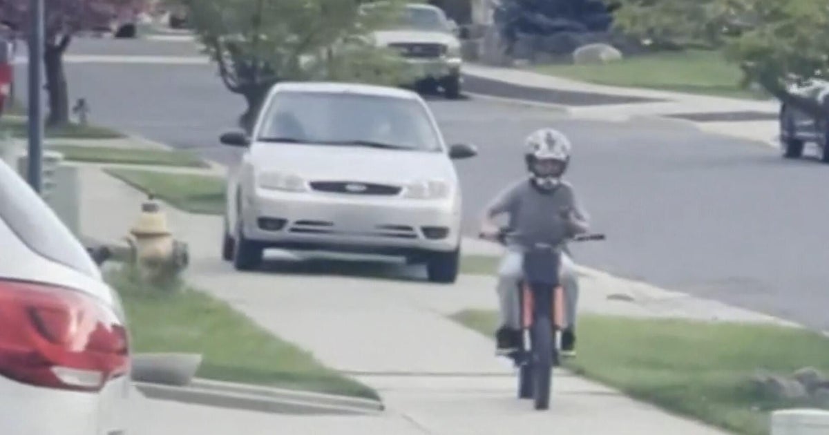 Driver accused of chasing child on bike down a sidewalk before attempting to break into a home