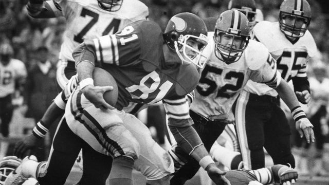 Vikings tight end Joe Senser attracted the attention of the Saints' Derland Moore (74), Jim Kovach (52), and Rob Nairne (55) after catching a pass in the third quarter. (Nov 16, 1981). 