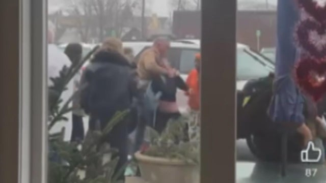 An image from a social media video showing the altercation between the Scott McElree and a group of students 