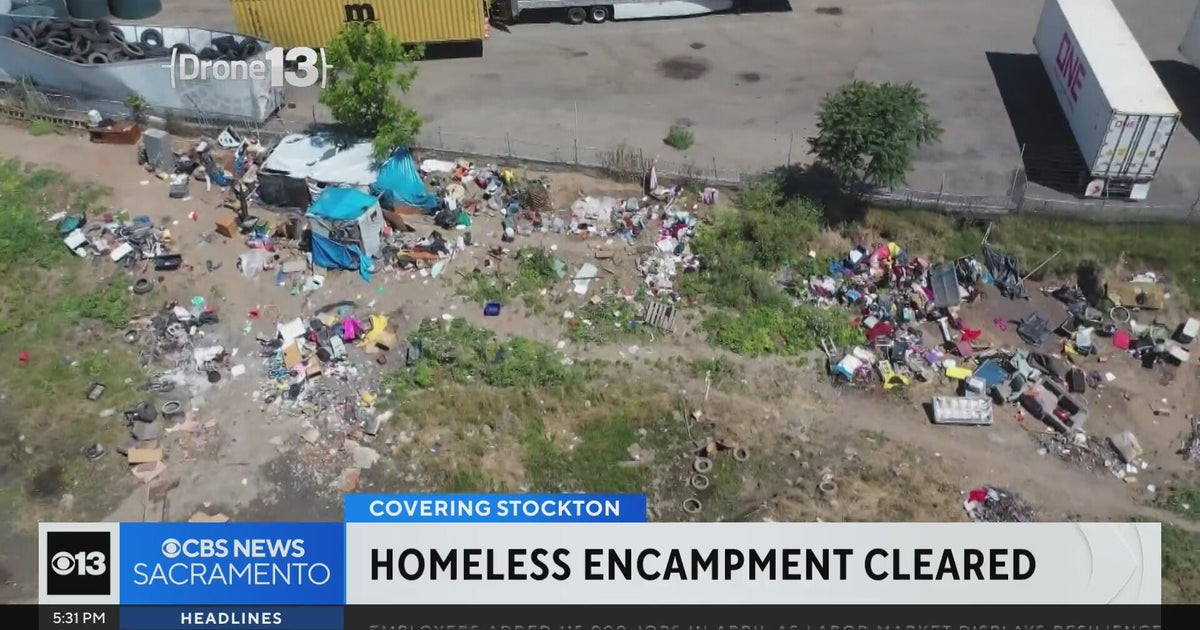 Stockton city officials clean up homeless camp behind church