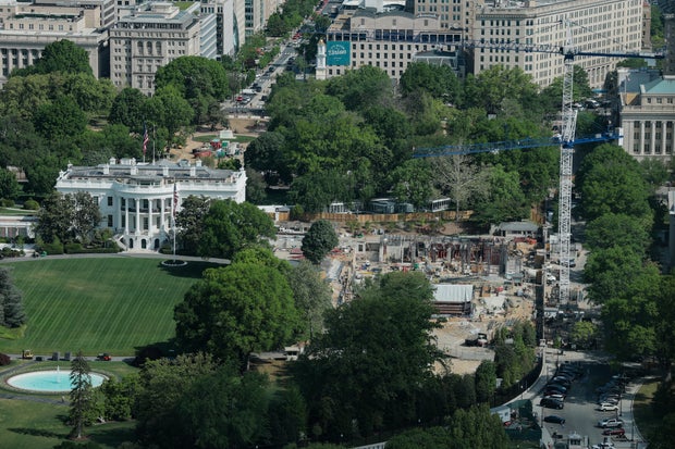 Construction cranes are seen from the Washington Monument on the site of the former East Wing of the White House on April 17, 2026 in Washington, D.C. 