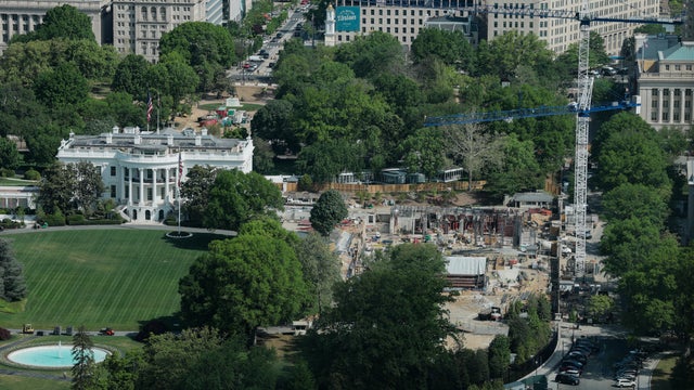 Construction cranes are seen from the Washington Monument on the site of the former East Wing of the White House on April 17, 2026 in Washington, D.C. 