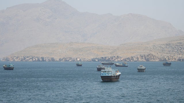 Vessels are seen in the Strait of Hormuz from Musandam, Oman, May 8, 2026. 