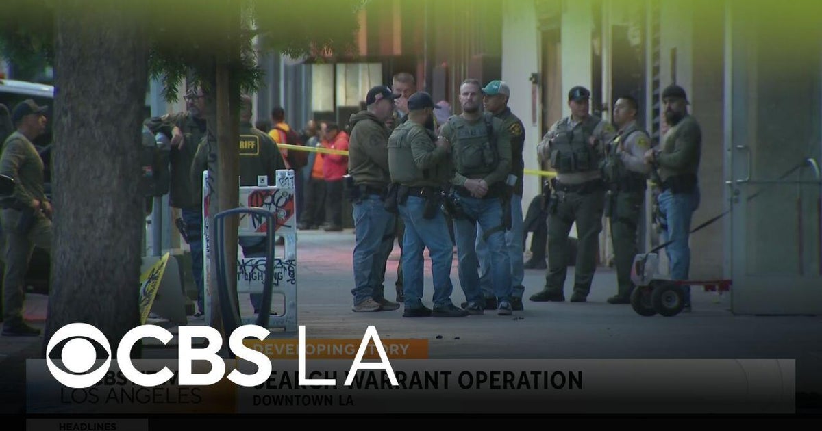 Deputies serve a search warrant at a Downtown LA business