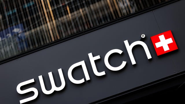 Swatch brand logo on a store of the watch brand 