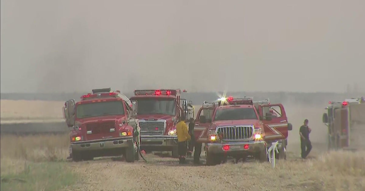 Firefighters work to contain brush fire north of Colorado Air and Space ...