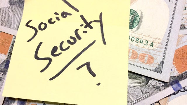 American cash money and yellow paper note Social Security with question mark 