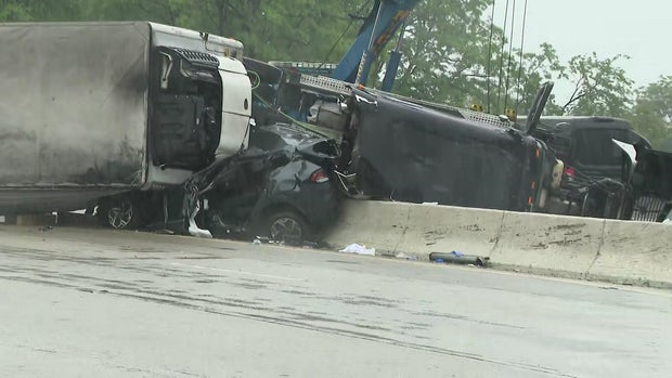 Tractor-trailer overturned onto SUV and concrete barrier 