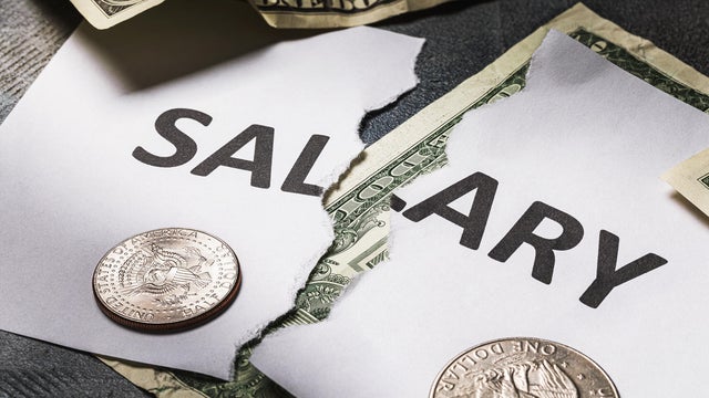 The inscription salary is torn in half. Concept on the financial crisis. There will be no salary 