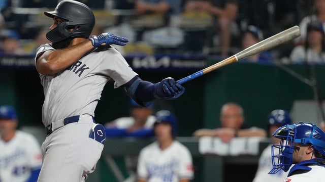 Amed Rosario #14 of the New York Yankees hits a two-run home run in the ninth inning against the Kansas City Royals at Kauffman Stadium on May 26, 2026 in Kansas City, Missouri. 
