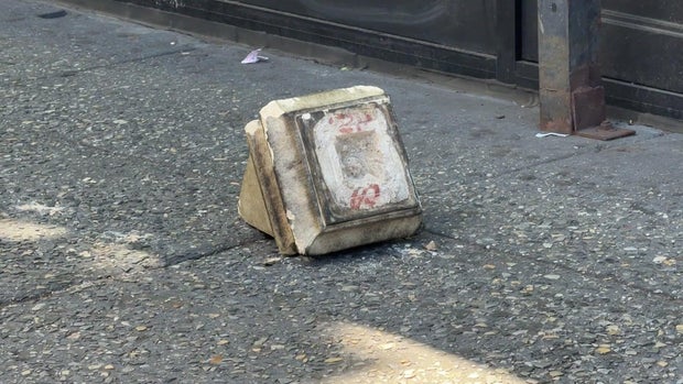 Piece of debris from building on sidewalk