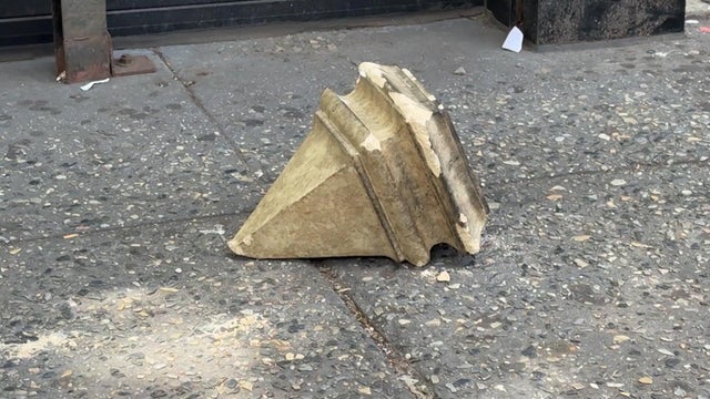 Piece of debris from building on sidewalk 