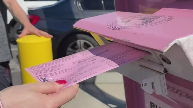 voter-dropping-off-mail-in-ballot.jpg 