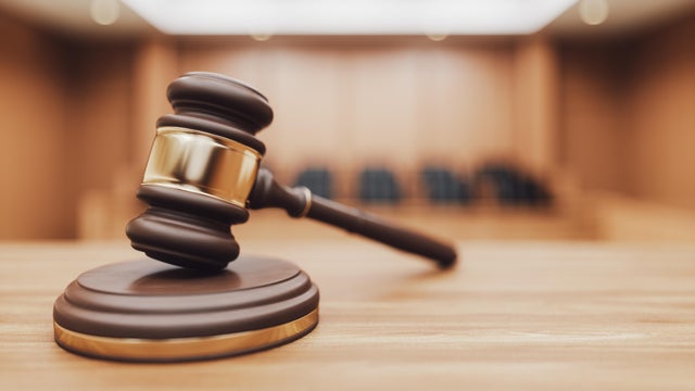 Gavel on a Courtroom Desk 