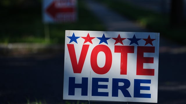 A sign in Cherry Hill says Vote Here on primary election day in New Jersey 