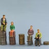 Elderly people sitting on coin, Time counting down for retirement concept, social security income and pensions 