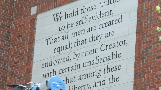 Exterior shot of the Museum of the American Revolution - the first words of the Declaration of Independence are on the wall - we hold these truths to be self-evident, that all men are created equal, that they are endowed by their creator with certain unalienable rights. 