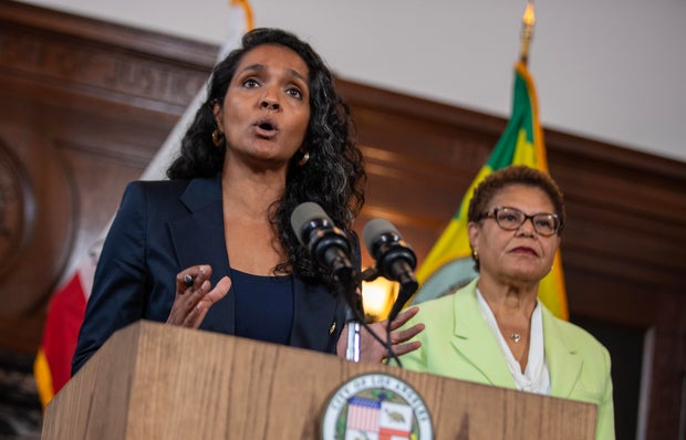 Nithya Raman, right, speaks alongside Los Angeles Mayor Karen Bass