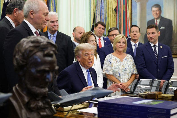 Trump signs $70 billion immigration bill, capping lengthy fight over ICE funding