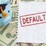 Default text with piggy bank with grad cap with torn blank paper on twenty dollar bills for student loan payments 