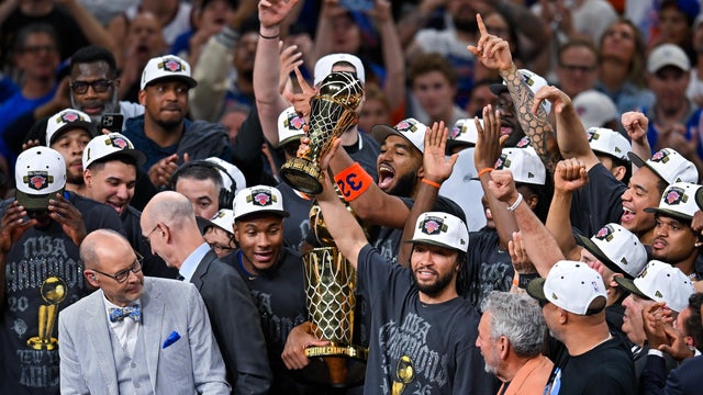 The New York Knicks celebrate with the Larry O'Brien Championship Trophy after defeating the San Antonio Spurs in Game 5 of the NBA Finals basketball series, Saturday, June 13, 2026, in San Antonio. 