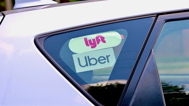 Lyft and Uber Stickers Inside Car, George Mason University, Fairfax, Virginia (USA) 