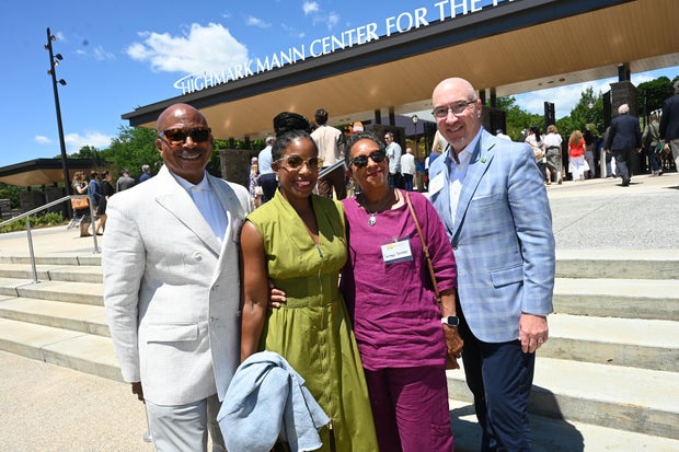 People celebrate the opening of the new Mann Center campus