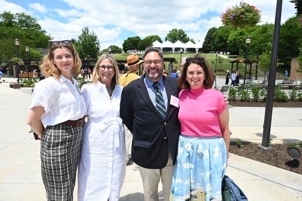 People celebrate the opening of the new Mann Center campus