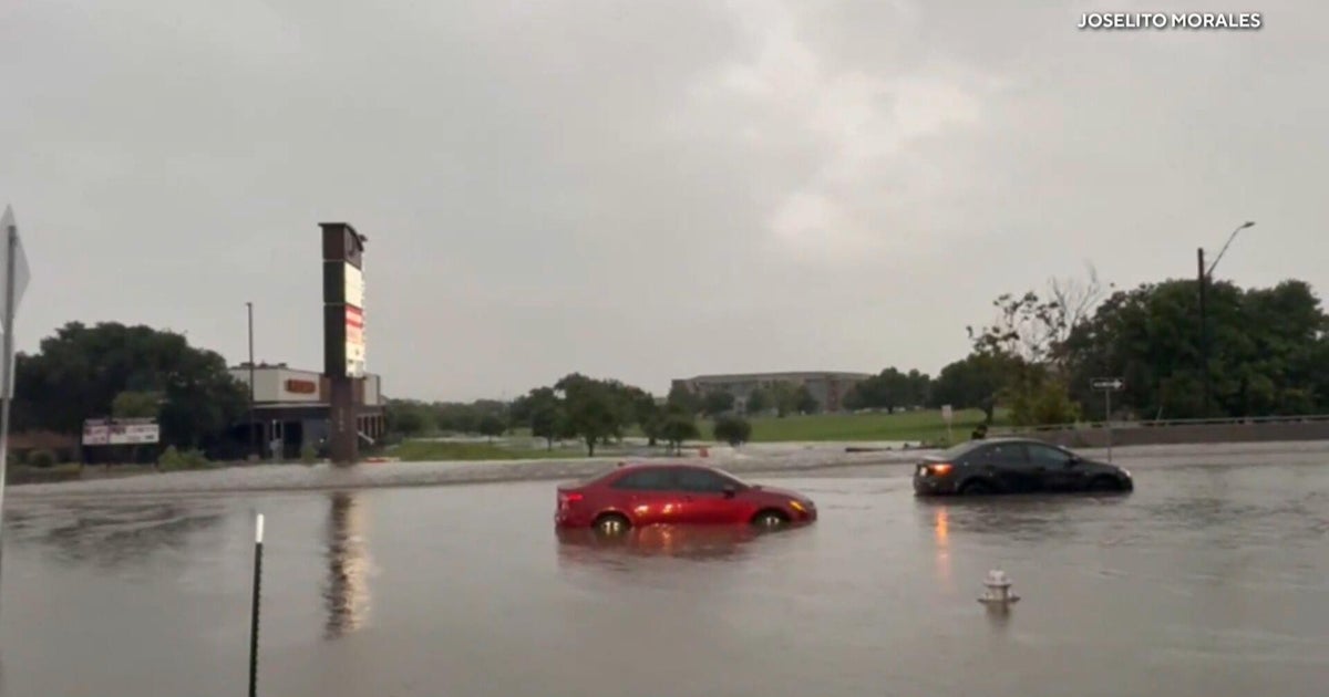 Heavy rain slams Texas, trapping drivers and damaging roads