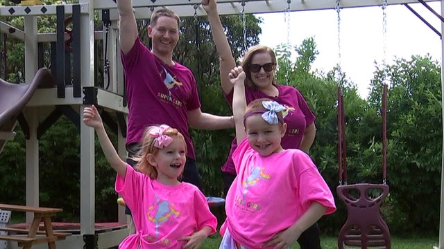 The Isaacs family dances together in their yard 