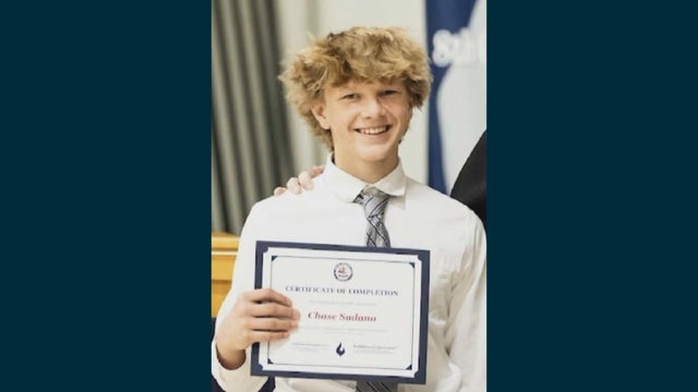 Chase Sudano holds a certificate 