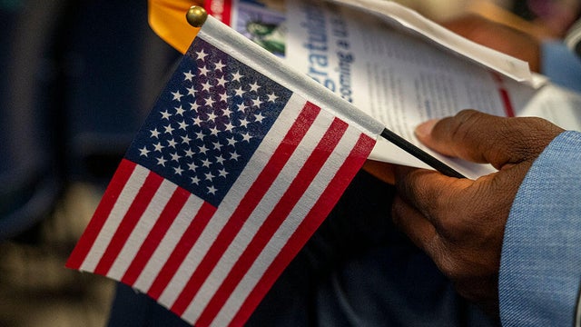 Candidates for U.S. citizenship wait to receive certificates of naturalization during a ceremony in New York on June 4, 2025. 