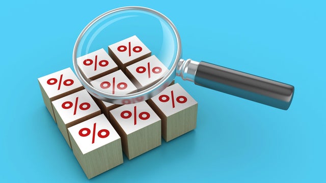 Percentage Symbol Blocks with Magnifying Glass 