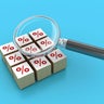 Percentage Symbol Blocks with Magnifying Glass 