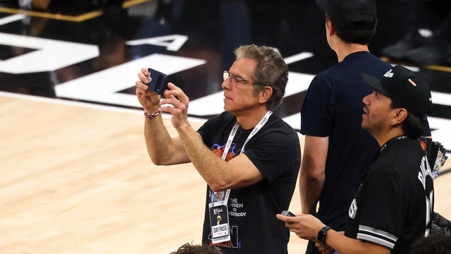 Ben Stiller records a video during the second quarter in Game Five of the 2026 NBA Finals between the San Antonio Spurs and the New York Knicks at Frost Bank Center on June 13, 2026 in San Antonio, Texas. 