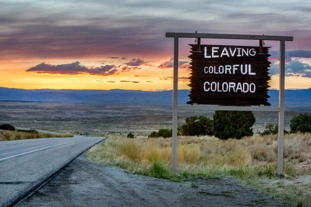Leaving Colorado Roadsign on a desolate interstate highway.