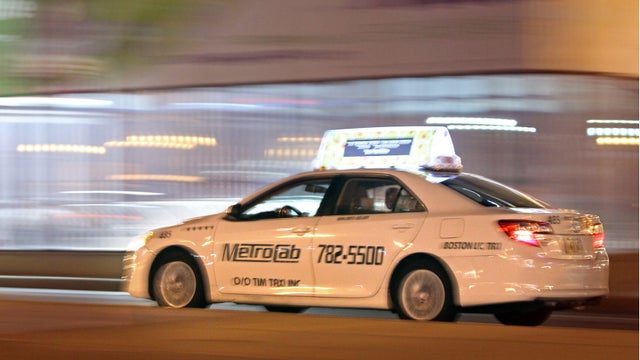 (Boston, MA,07/01/14) Cabs drive along Congress Street in Boston. Tuesday, July 01, 2014. (Staff photo by Stuart Cahill) 