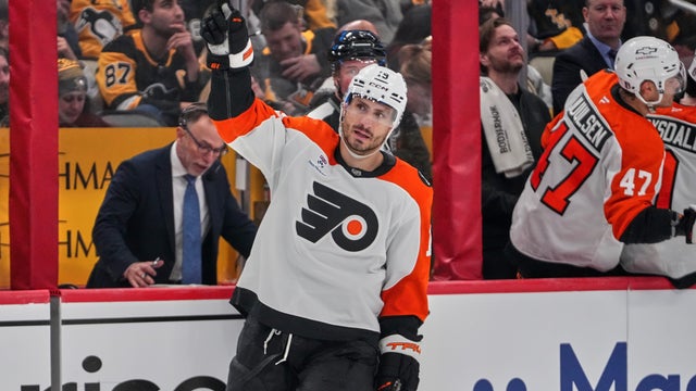 Garnet Hathaway raises an arm after scoring during a NHL playoffs game 